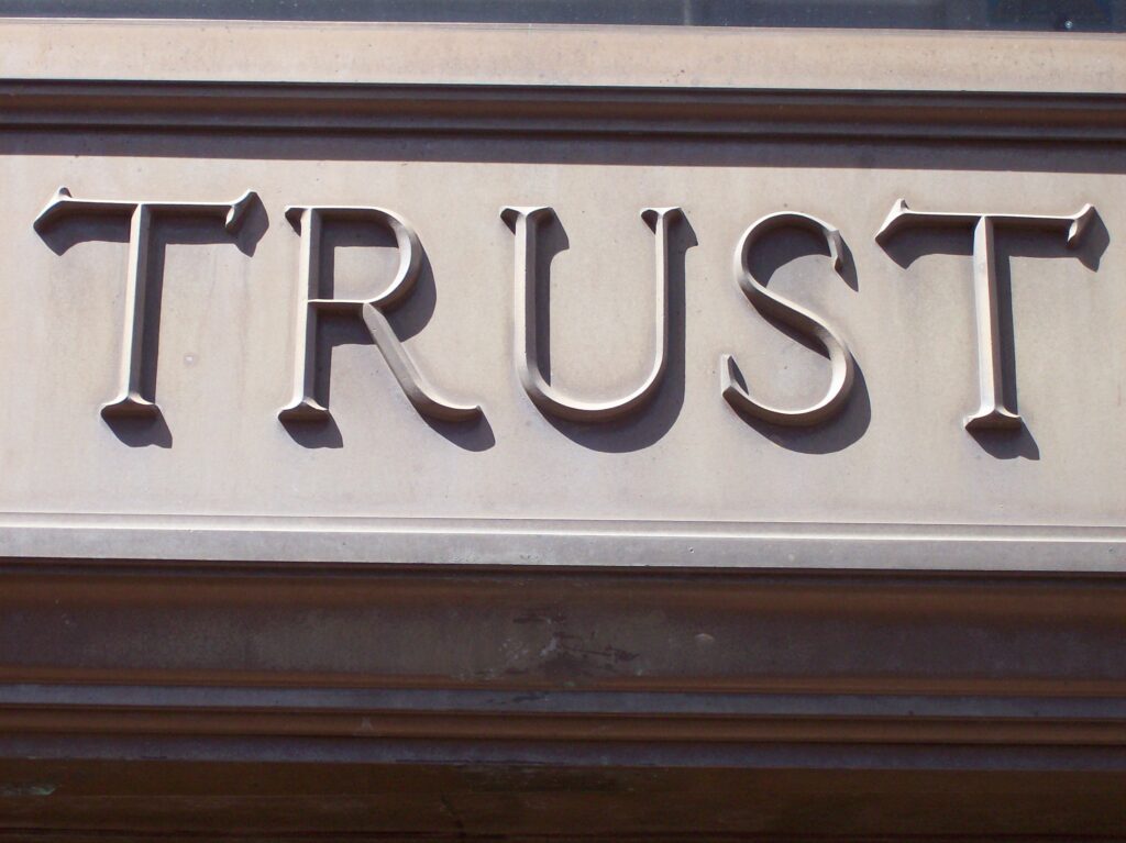 Are You Fully Invested on the Spiritual Path? building facade, the word trust