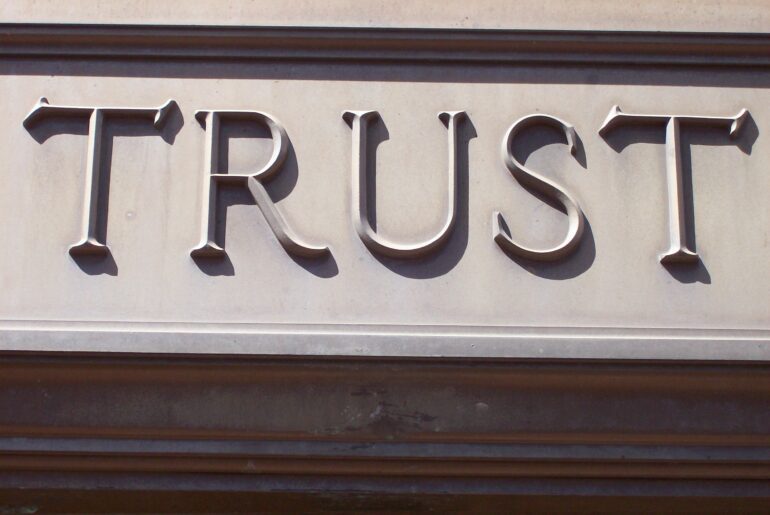 building facade, the word trust