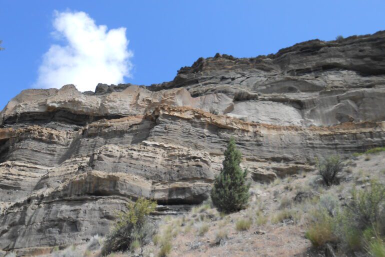 multi levels of rock and earth, cliff, blue sky